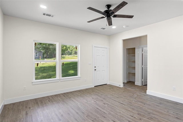 727 W Parnell St, Denison, TX 75020 - spare room featuring wood finished floors, baseboards, ceiling fan, and recessed lighting