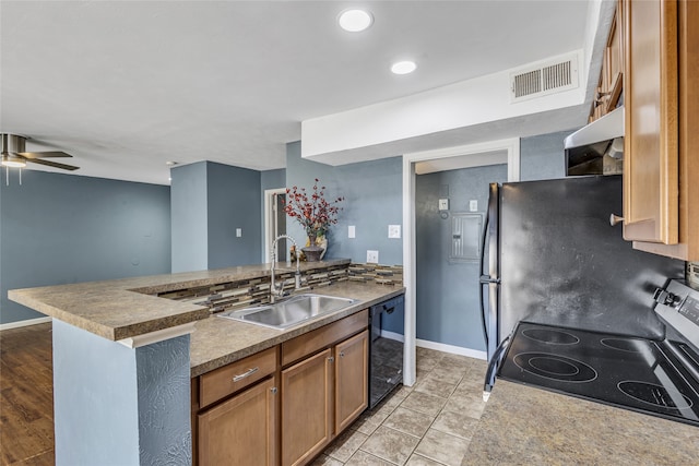 kitchen with sink, ceiling fan, and black appliances