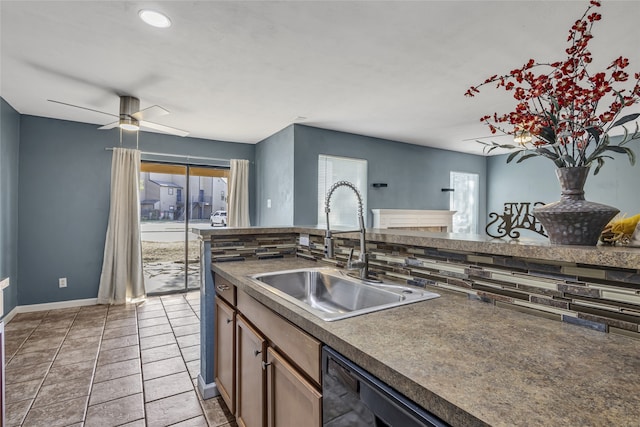 kitchen with backsplash, plenty of natural light, and sink