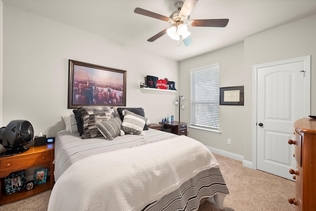 bedroom featuring light colored carpet and ceiling fan