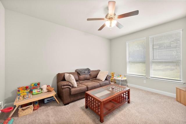 living room featuring light colored carpet and ceiling fan