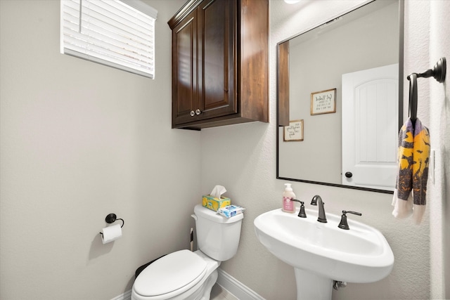 bathroom with sink and toilet