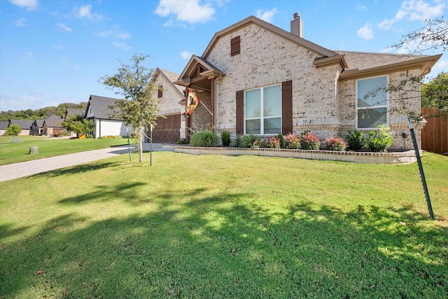 view of front facade with a front yard and a garage