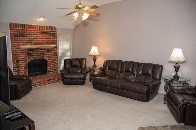 carpeted living room featuring lofted ceiling, ceiling fan, and a brick fireplace