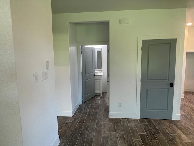 hall with dark hardwood / wood-style floors