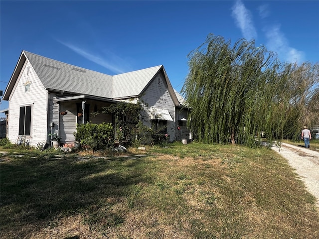 view of home's exterior featuring a lawn