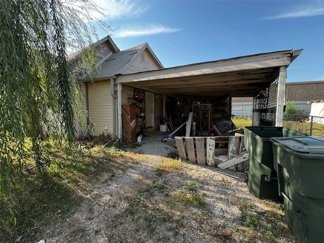 view of property exterior with a carport