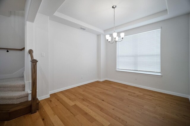 living room featuring ceiling fan, a high ceiling, and hardwood / wood-style floors