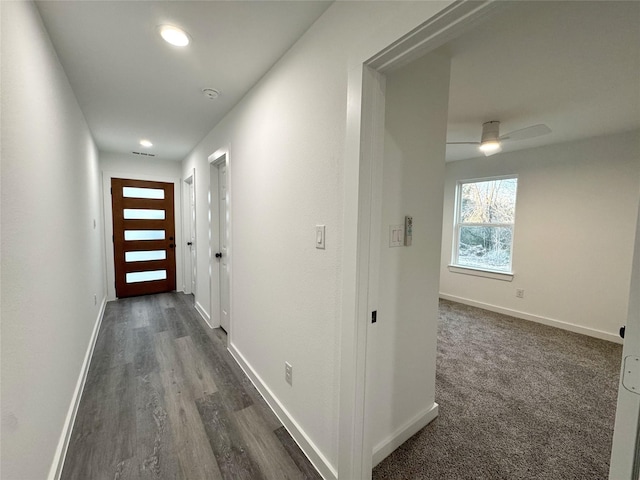 corridor with dark wood-type flooring