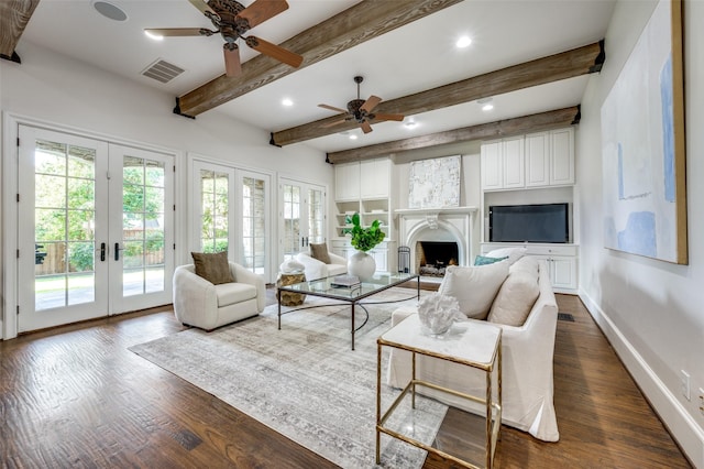 living room with french doors, ceiling fan, dark wood-type flooring, and beam ceiling