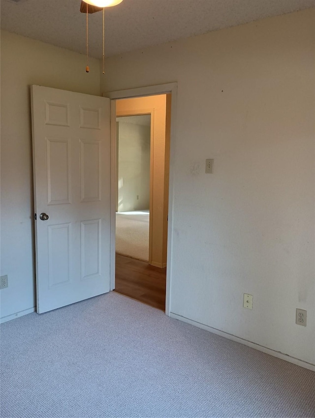 unfurnished bedroom with carpet floors