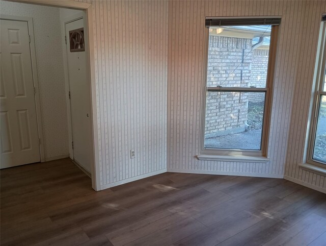 unfurnished room with hardwood / wood-style floors