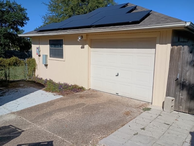 garage featuring solar panels