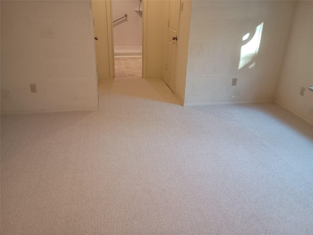 empty room with light colored carpet