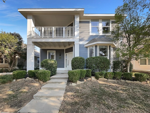 view of front of property with a balcony