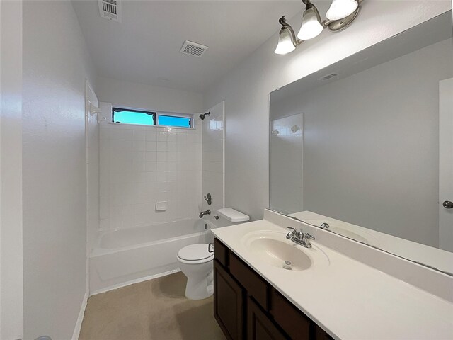 bathroom with visible vents, vanity, washtub / shower combination, and toilet