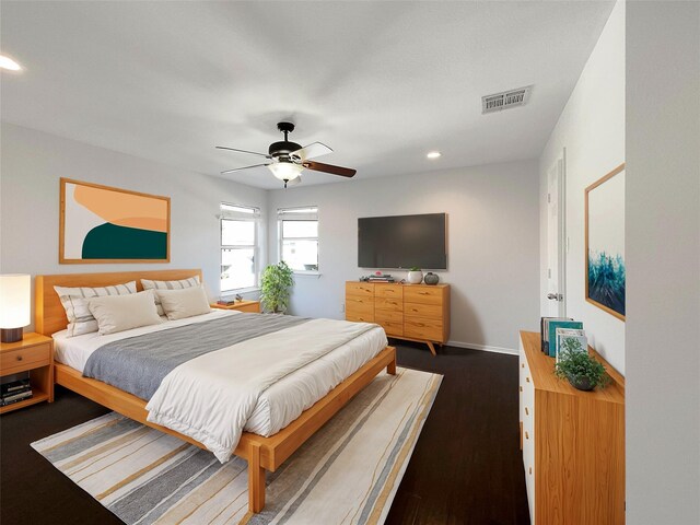 bedroom featuring recessed lighting, visible vents, a ceiling fan, dark wood-type flooring, and baseboards