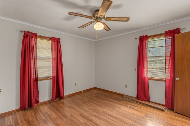 unfurnished room with ornamental molding and light hardwood / wood-style floors