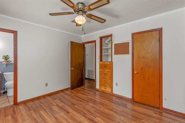 unfurnished bedroom featuring ensuite bathroom, crown molding, ceiling fan, and light hardwood / wood-style floors