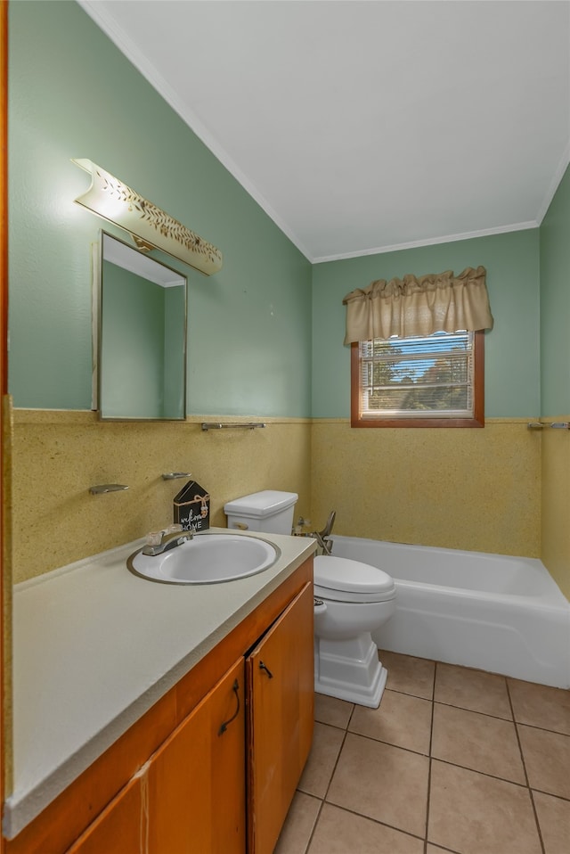 bathroom with vanity, crown molding, tile patterned flooring, a bathtub, and toilet