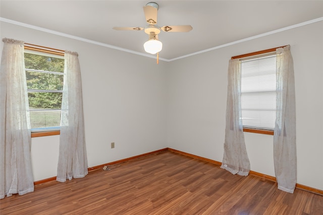 spare room with crown molding, hardwood / wood-style floors, and ceiling fan