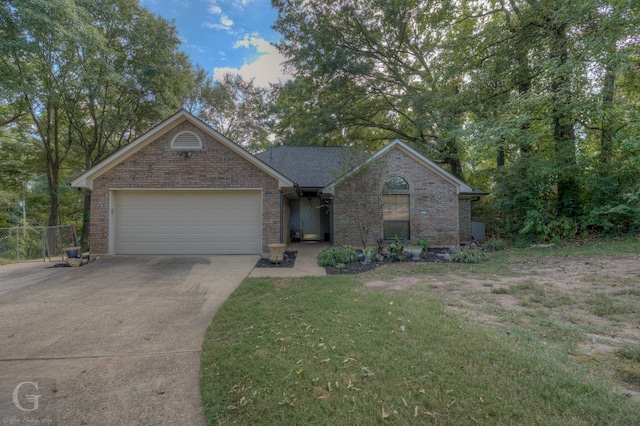 single story home featuring a front yard and a garage