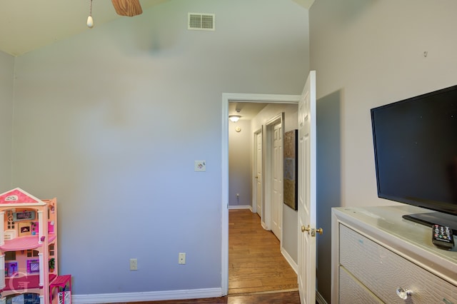 bedroom featuring vaulted ceiling and hardwood / wood-style floors