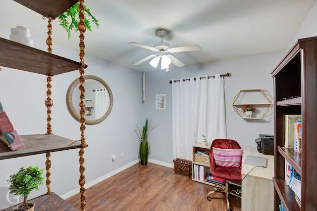 office with dark wood-type flooring and ceiling fan