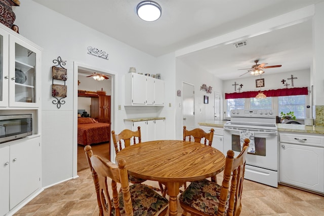 dining space featuring ceiling fan