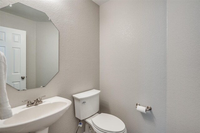 bathroom with sink and toilet