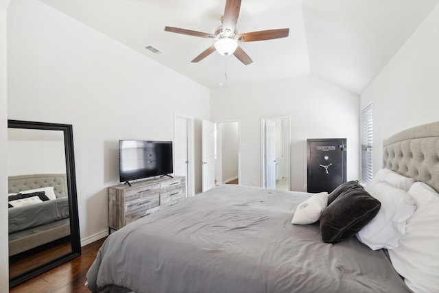 bedroom featuring dark wood-type flooring, vaulted ceiling, and ceiling fan