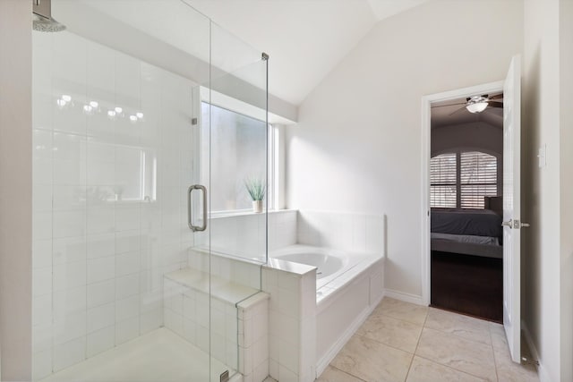 bathroom featuring tile patterned flooring, ceiling fan, vaulted ceiling, and independent shower and bath