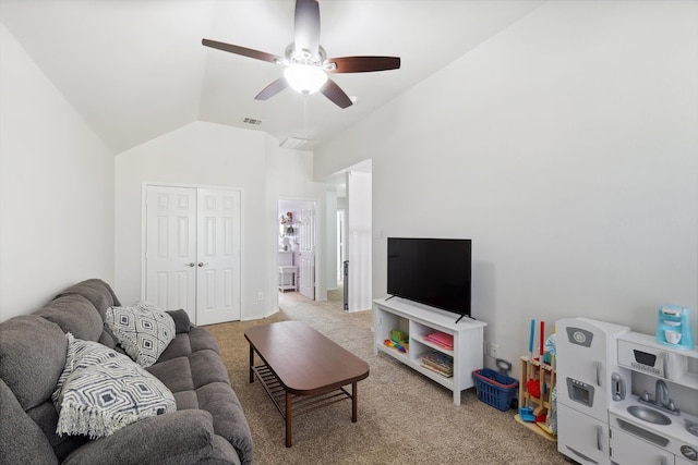 carpeted living room featuring vaulted ceiling and ceiling fan