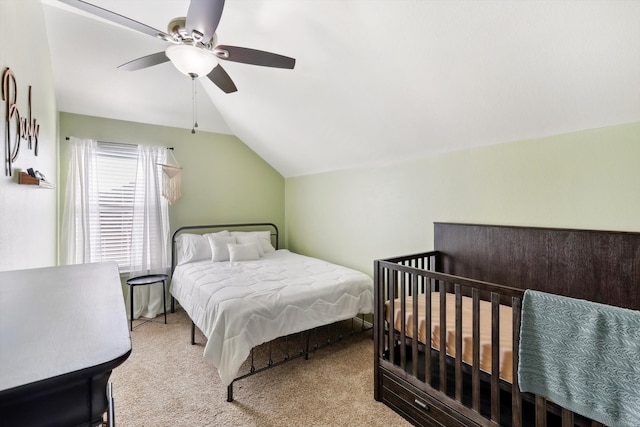 carpeted bedroom featuring ceiling fan and lofted ceiling