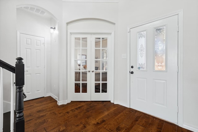 entrance foyer featuring french doors and dark hardwood / wood-style floors