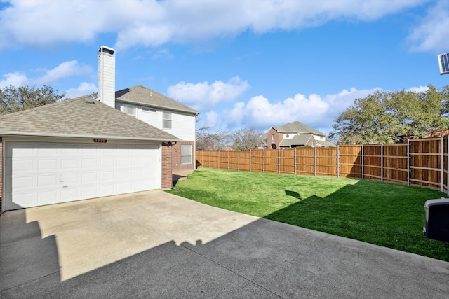 view of yard with a garage