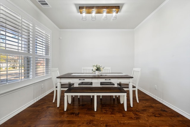 dining space with dark hardwood / wood-style floors and ornamental molding