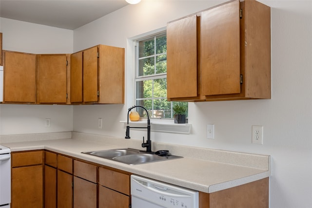 kitchen featuring sink and white appliances