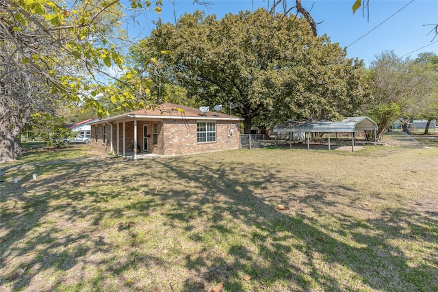 view of yard with a carport