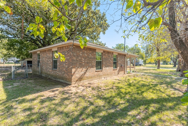 view of home's exterior with a lawn