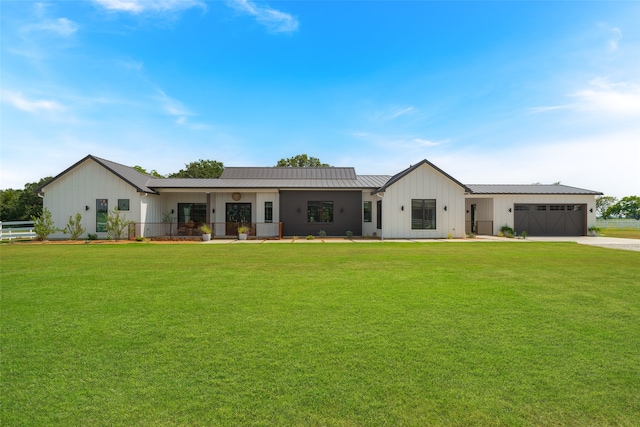 view of front facade featuring a front lawn and a garage