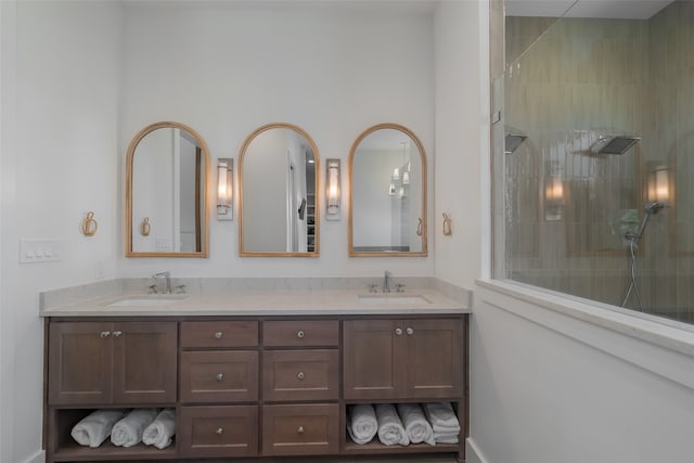 bathroom featuring vanity and tiled shower