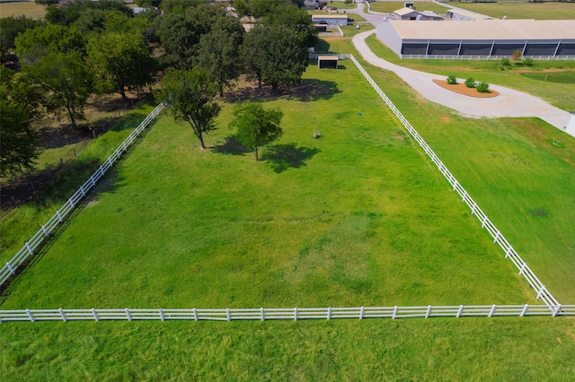 birds eye view of property with a rural view