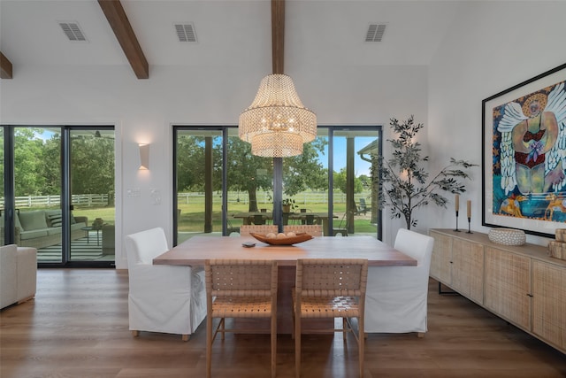 dining area with a chandelier, beam ceiling, a towering ceiling, and dark wood-type flooring