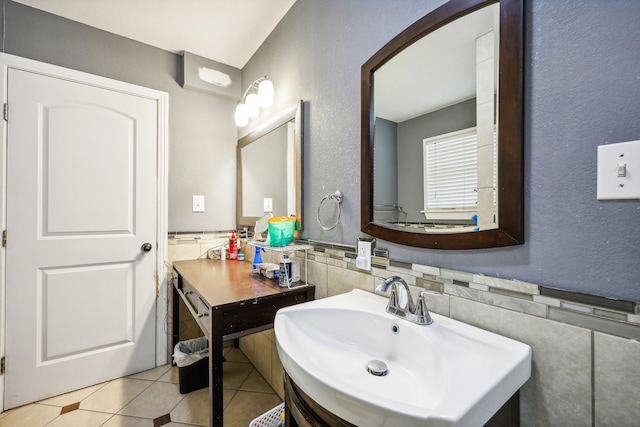 bathroom featuring tile walls, sink, and tile patterned flooring