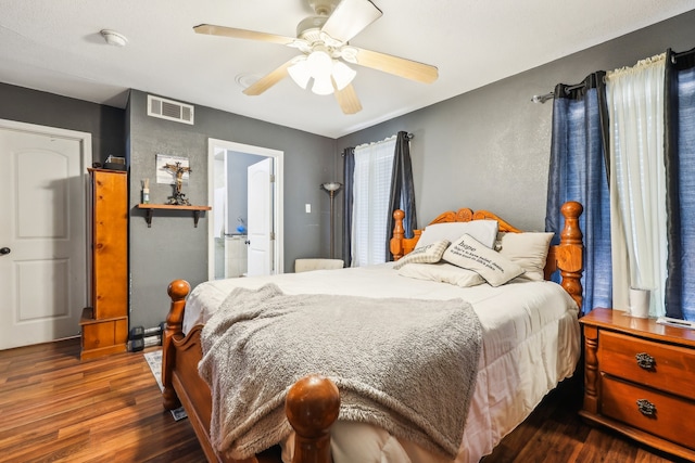 bedroom with ceiling fan and dark hardwood / wood-style flooring