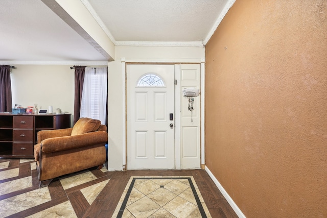 entryway featuring ornamental molding and dark hardwood / wood-style flooring