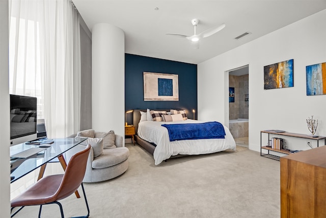 carpeted bedroom featuring ensuite bathroom and ceiling fan