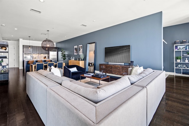 living room featuring dark hardwood / wood-style flooring