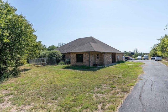 view of property exterior with a yard